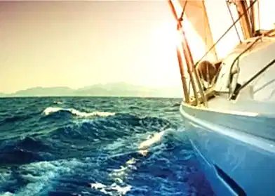 A yacht sailing in the sea.